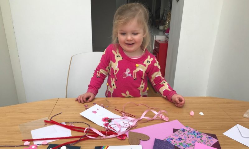 Toddler getting excited about making the Valentines Day cards