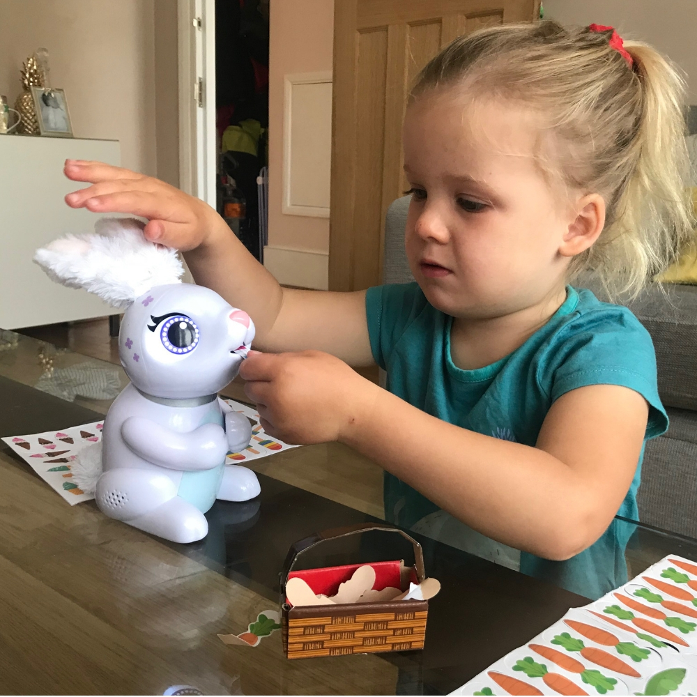 My toddler feeding the Zoomer Hungry Bunny