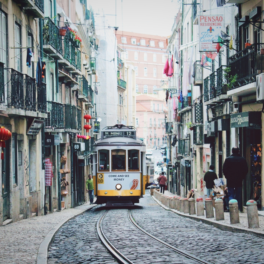 Gorgeous cobbled street with tram in Lisbon