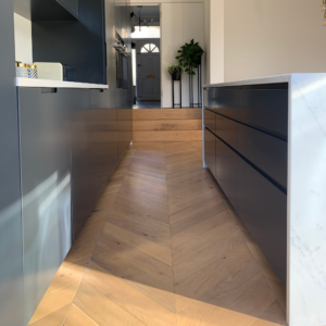 A light oak engineered chevron wood floor was placed in the new kitchen extension