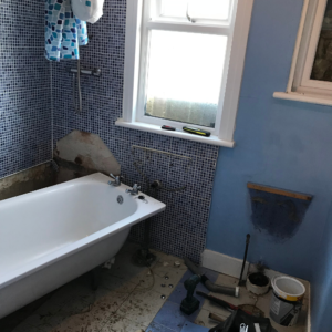 Snapshot of the old blue bathroom being ripped out