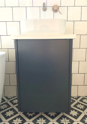 The bespoke vanity sink unit created with bespoke door fronts on an IKEA carcass
