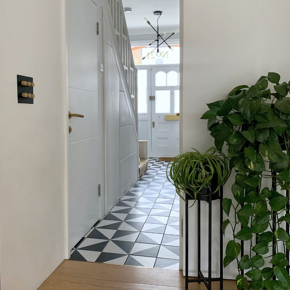 Our hallway is mostly white and light grey, with darker tones in the tiles