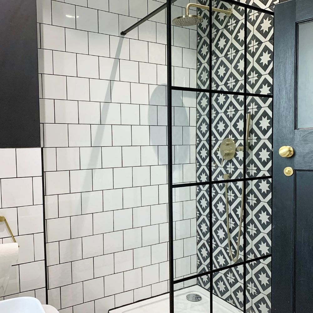 Our shower is predominantly black and white with hints of colour in the shower and mixer valves.