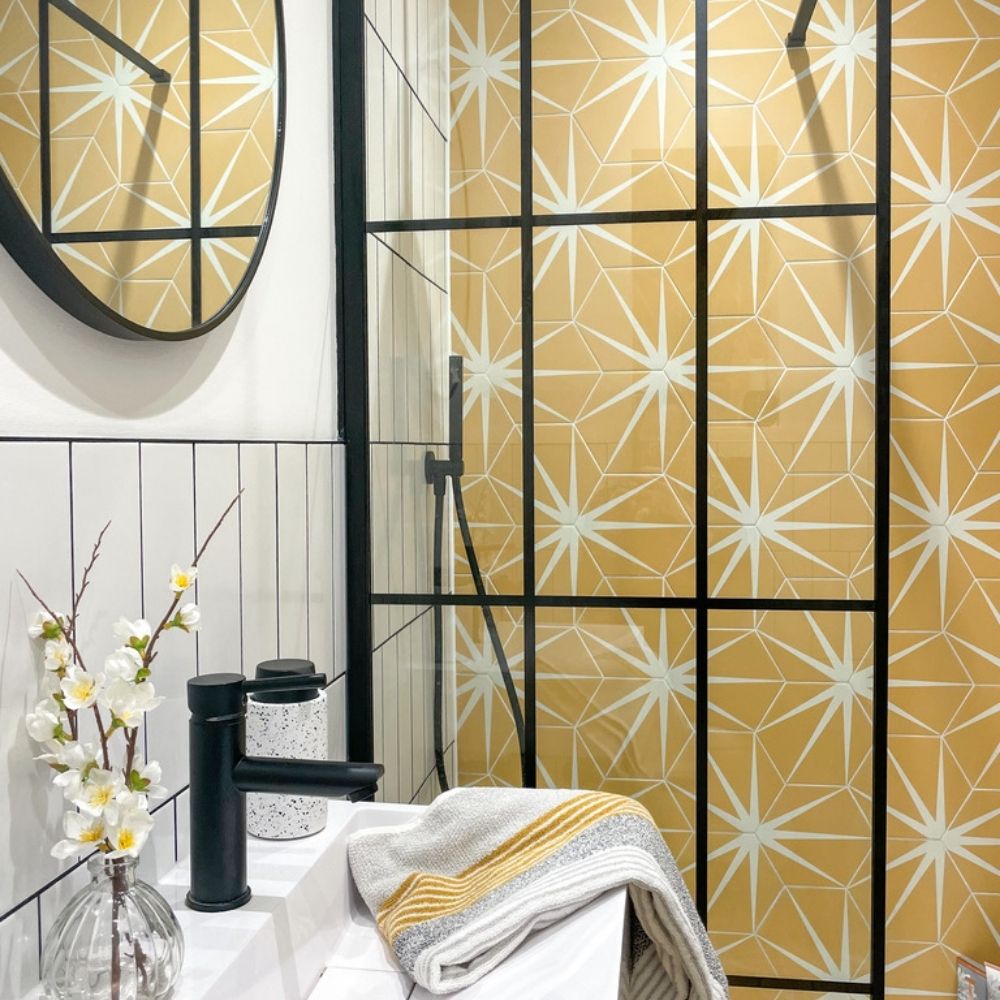 Kelly's monochrome bathroom with yellow lily pad tiles. 