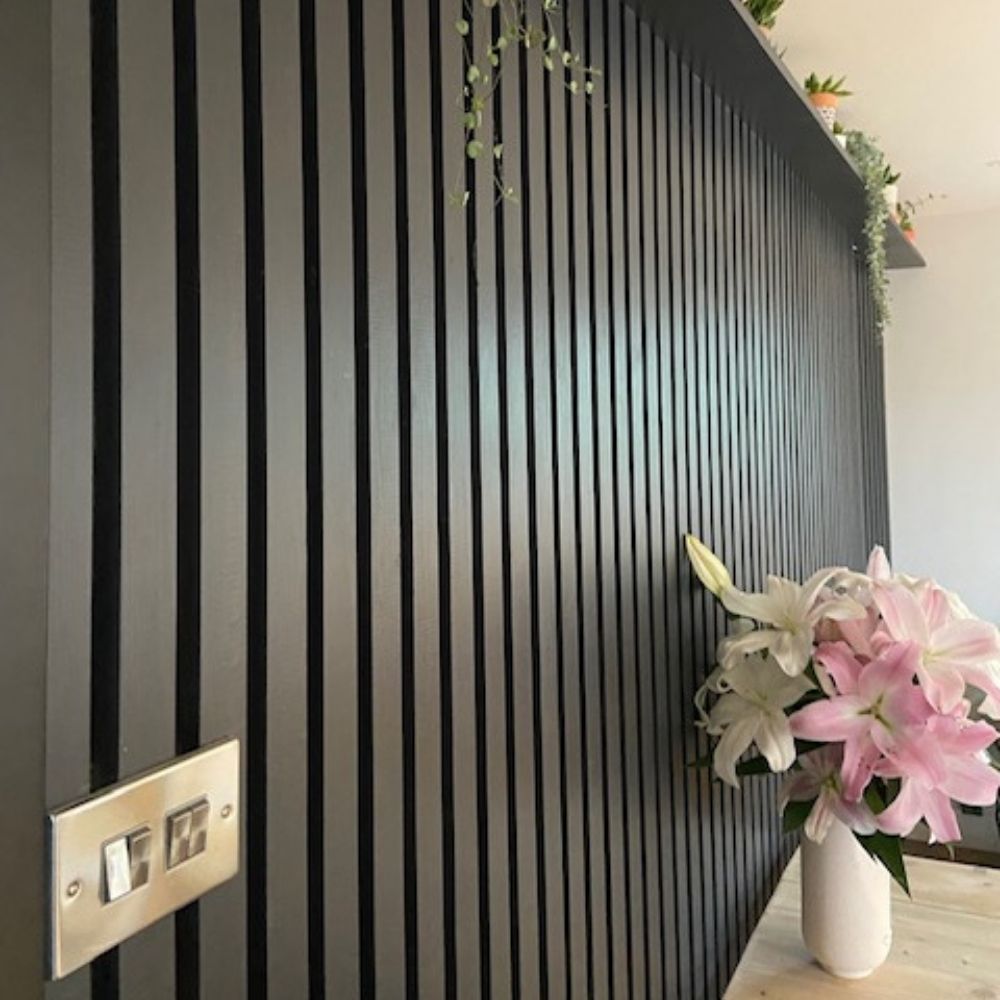 The stunning black reeded wall.