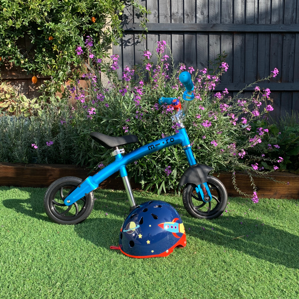 Balance Bike in the garden with matching helmet